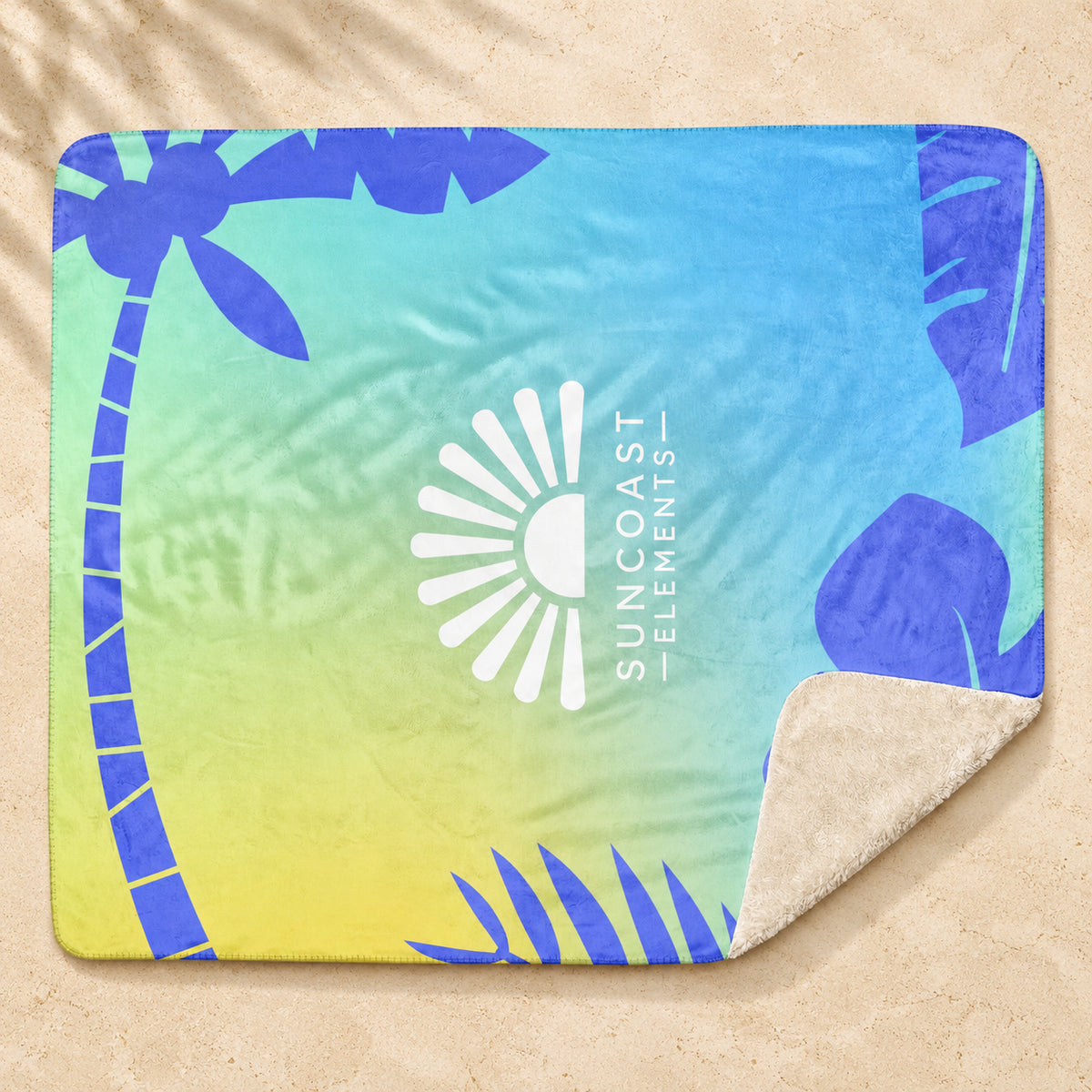 Coastal Colorblock Sherpa Blanket — Blue / Green on pale coastal limestone with palm shadows